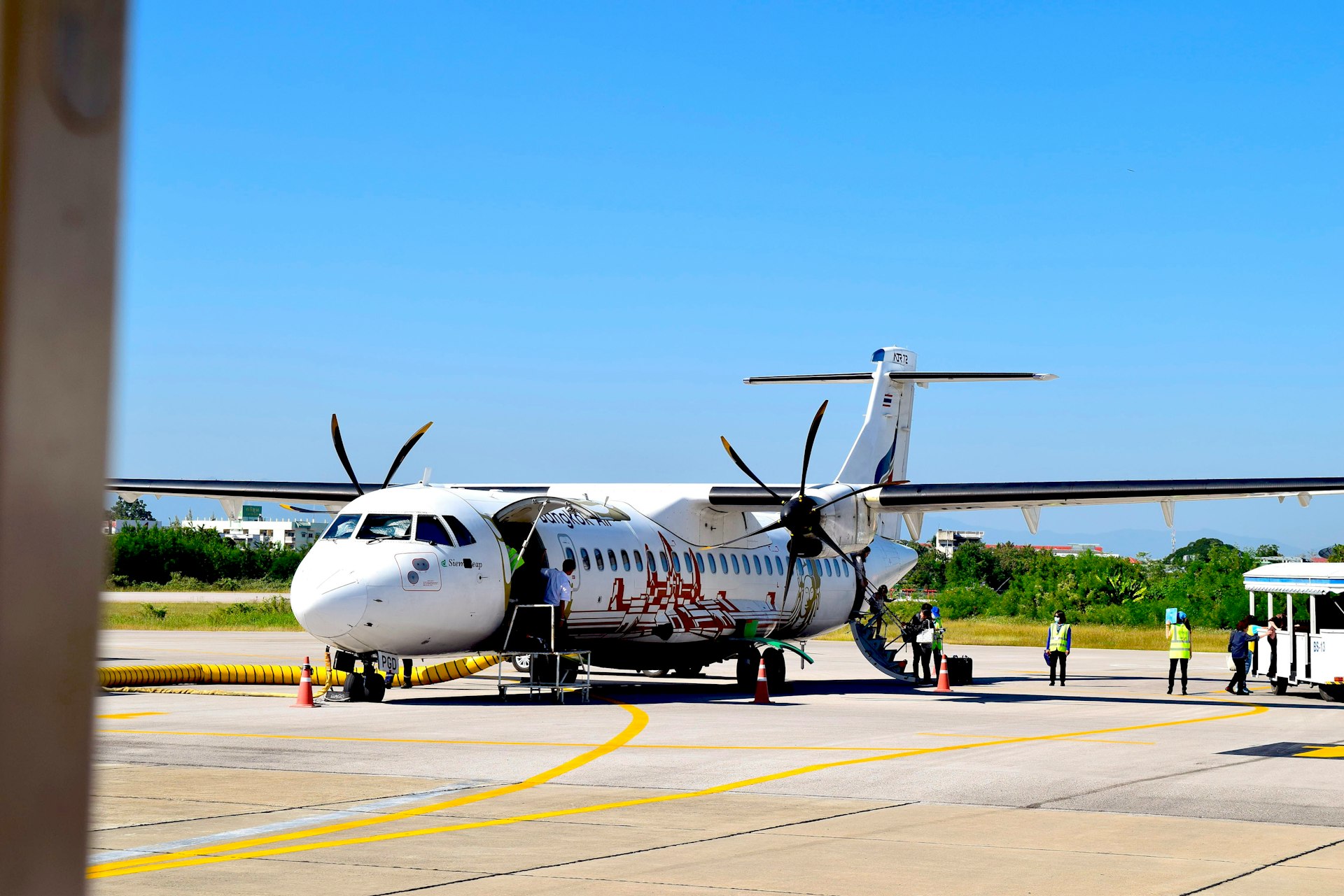 an airplane is parked on the tarmac at an airport